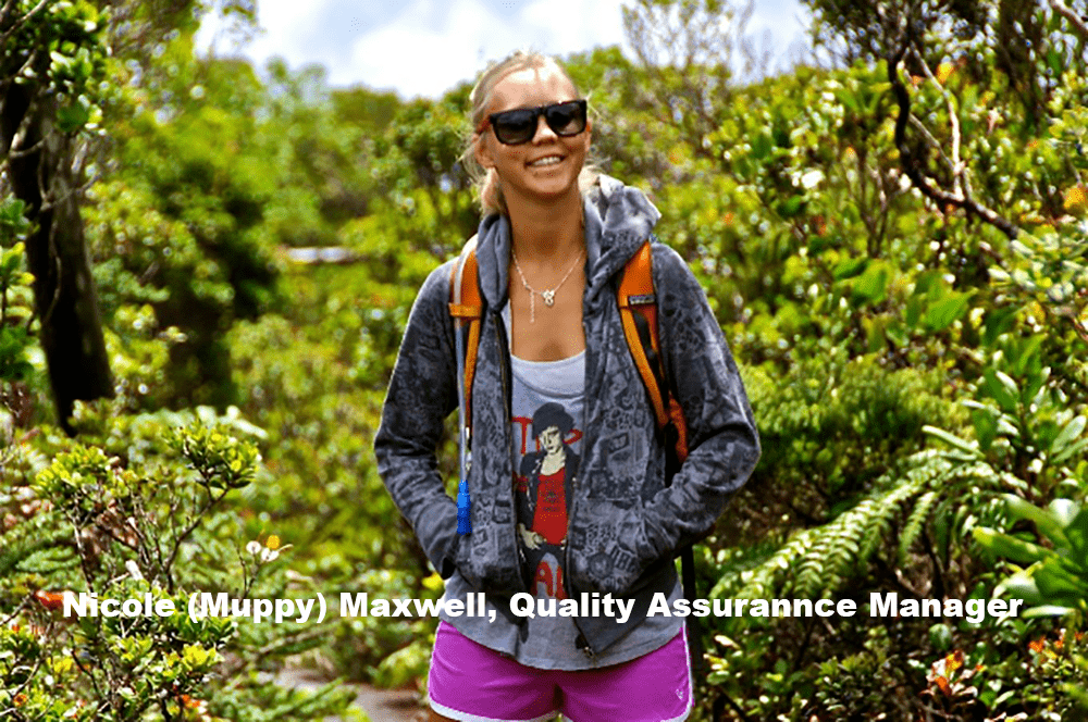 Muppy from Outfitters Kauaʻi walking through the island’s tropical forest on a Kauaʻi adventure tour.