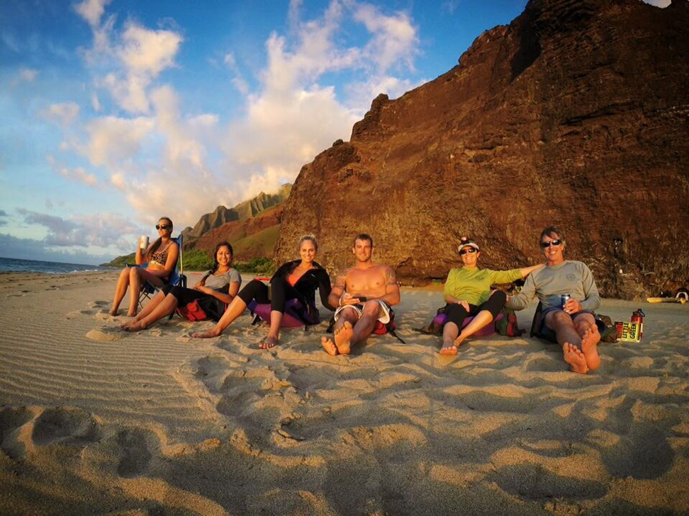 Outfitters Kauaʻi founders Rick and Julie Haviland on a Kauaʻi beach, the island that inspired their adventure tour company.