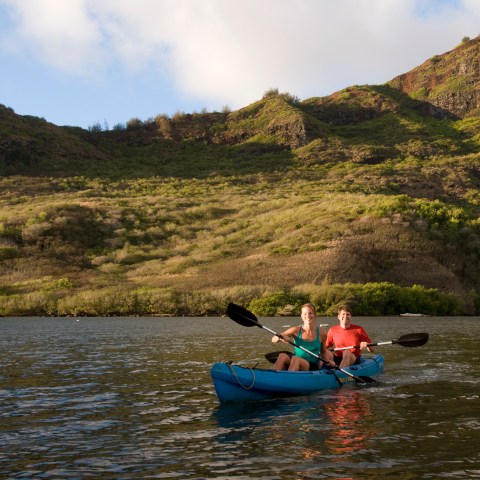People kayaking on a river.