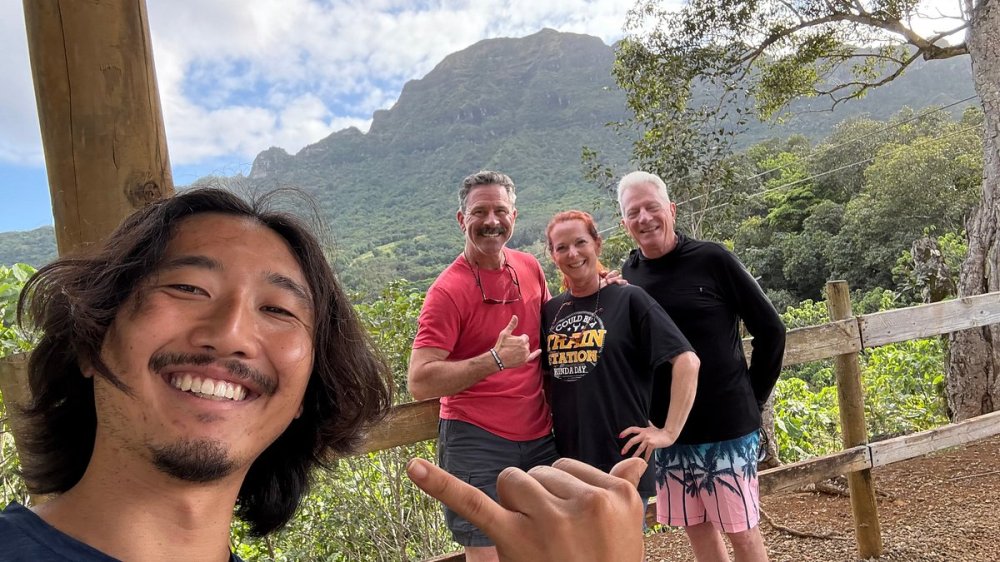Zipliners posing with Outfitters Kauai guide after the Flyline Zipline with Outfitters Kauai.
